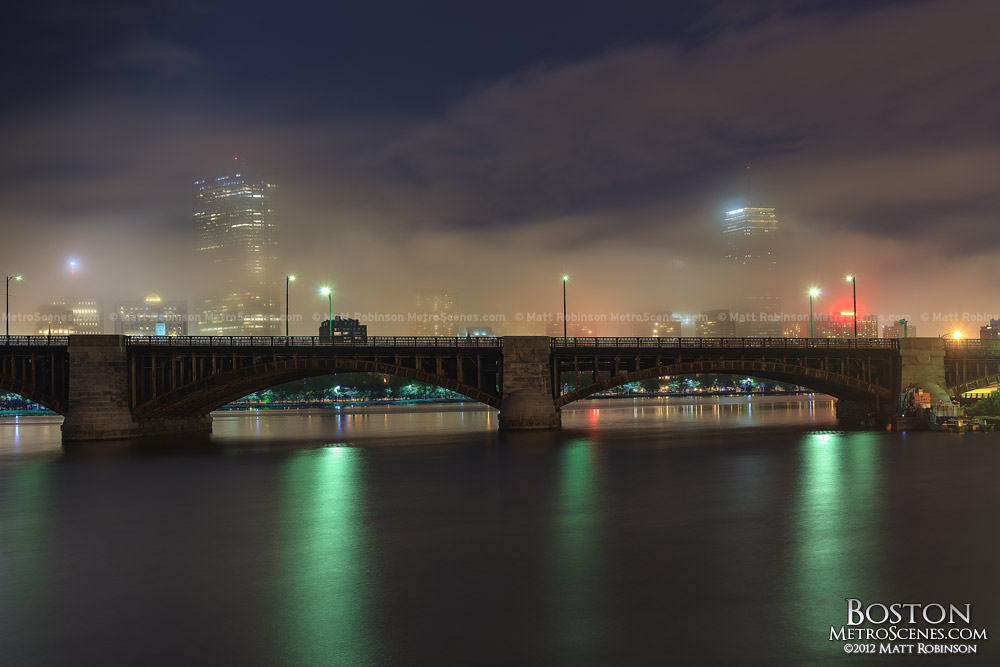 Fog obscures John Hancock Tower and Prudential Center over the Charles River