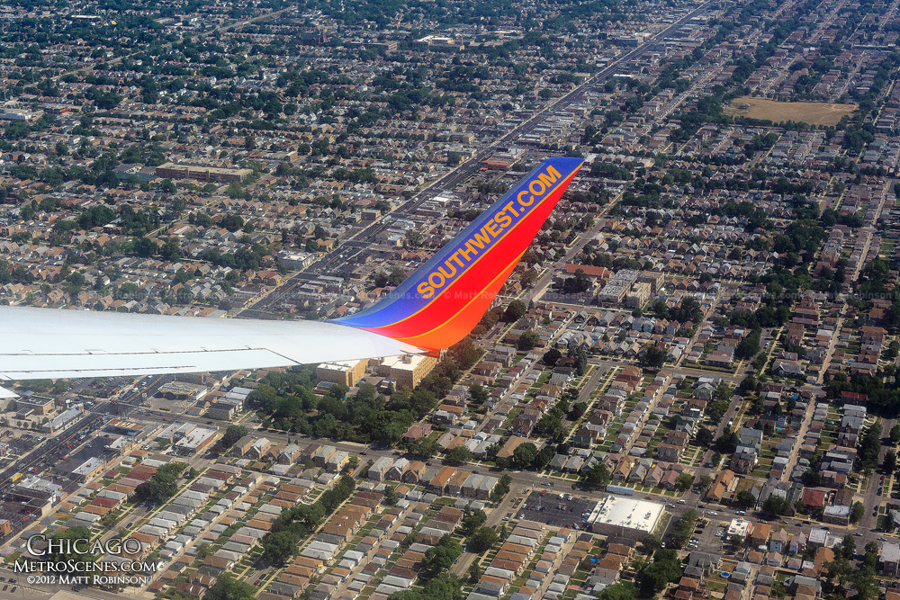 Airline wing over Residential Chicago