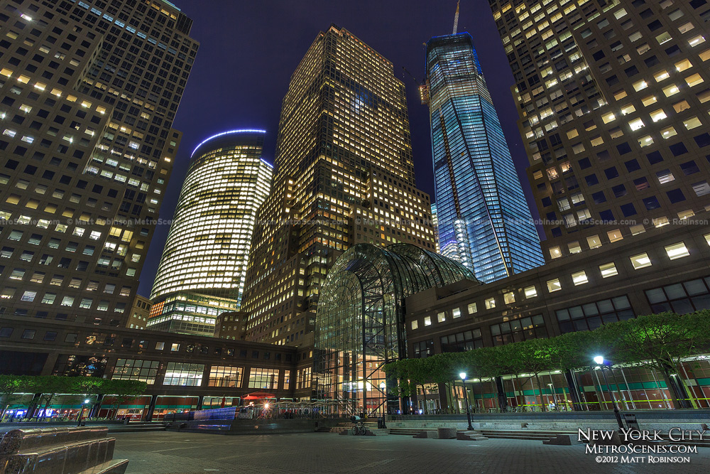 One World Trade Center rises with the World Financial Center at night
