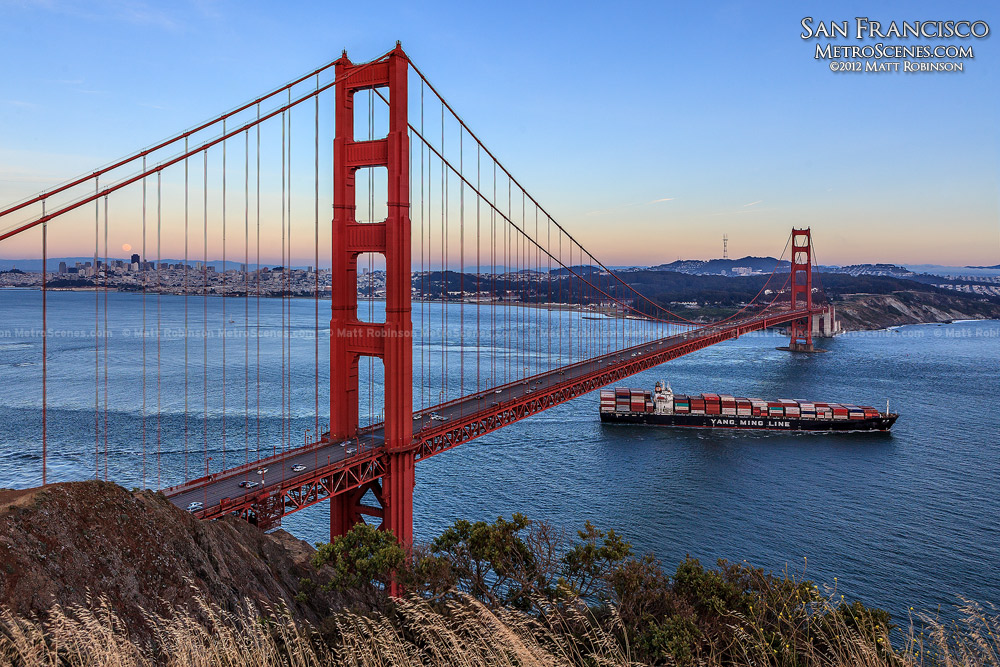 Cargo ship crosses under the Golden Gate Bridge