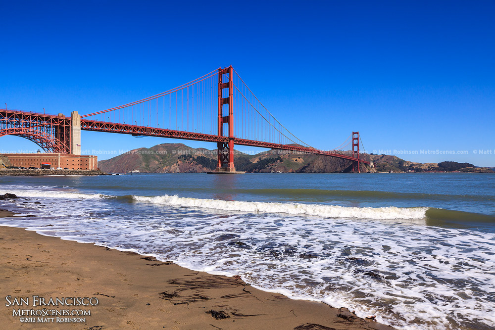 Golden Gate Bridge with shoreline near Fort Point