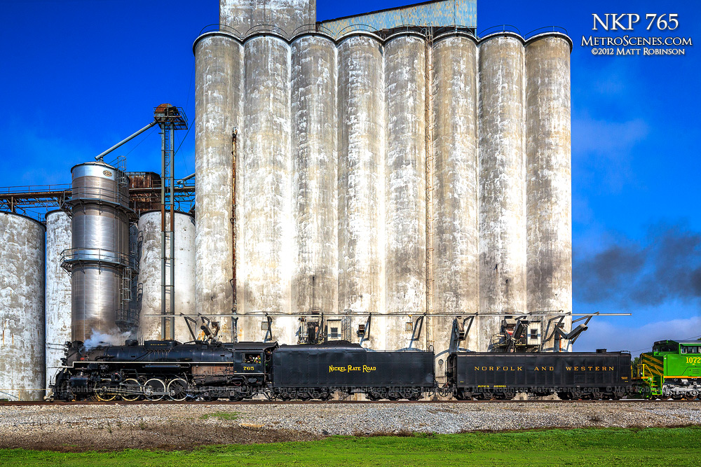 NKP 765 passes grain elevators