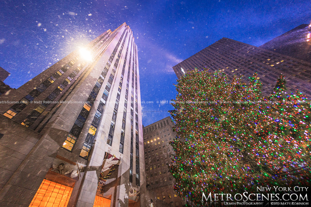 Snow falling with Rockefeller Center and Christmas Tree