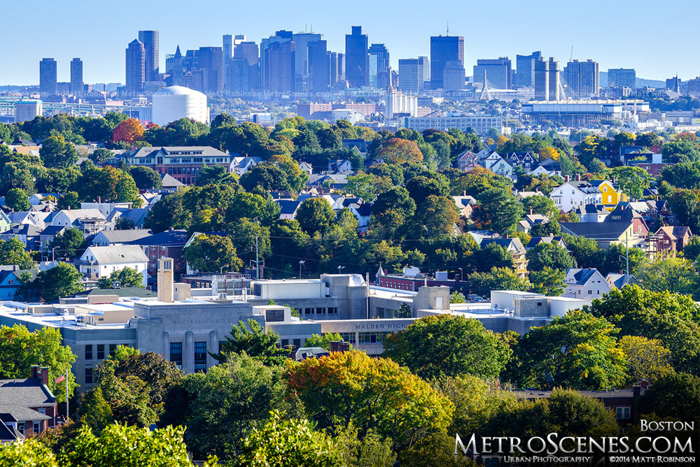 Downtown Boston Skyline over fall colors in Malden