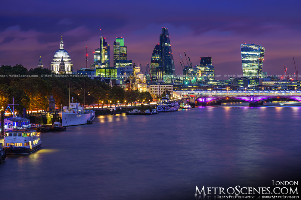Skyscrapers in The City of London after sunset from the Waterloo Bridge