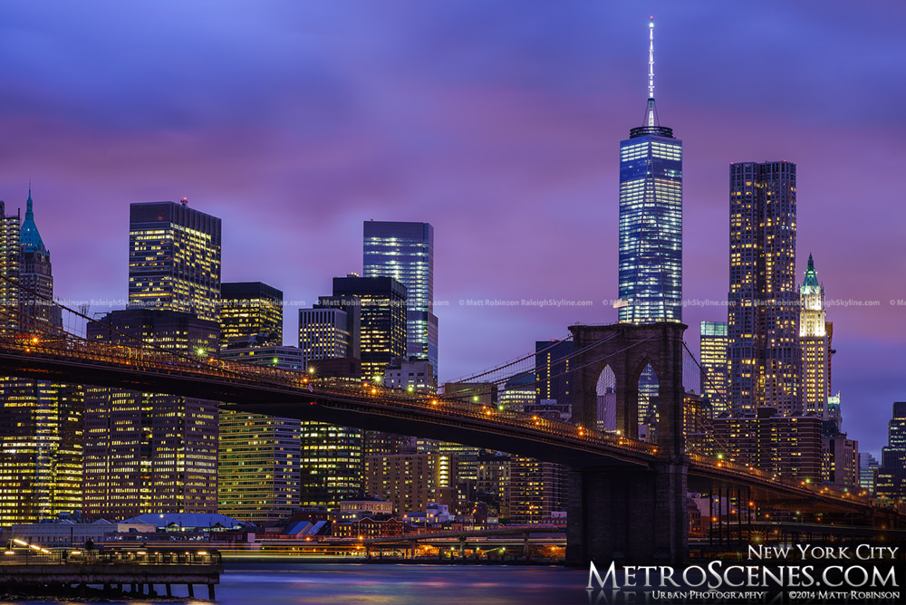 Night time DUMBO View of Lower Manhattan Skyline with the Brooklyn Bridge and One World Trade Center