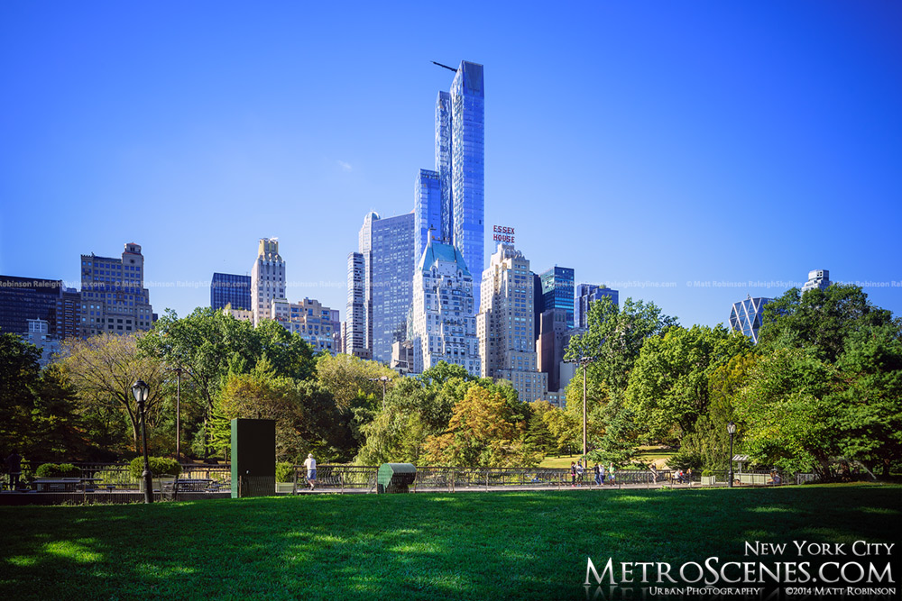 One 57 towers over and early fall day in Central Park