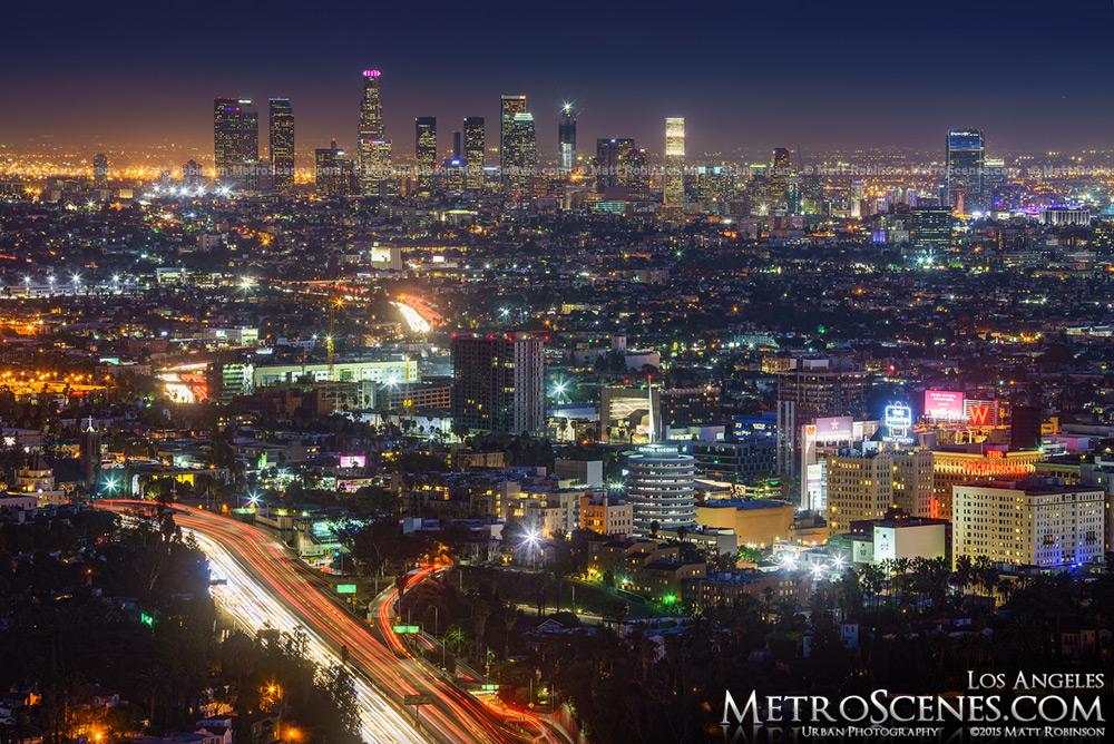 Los Angeles Skyline at night with traffic on the freeway with Wilshire Grand Tower